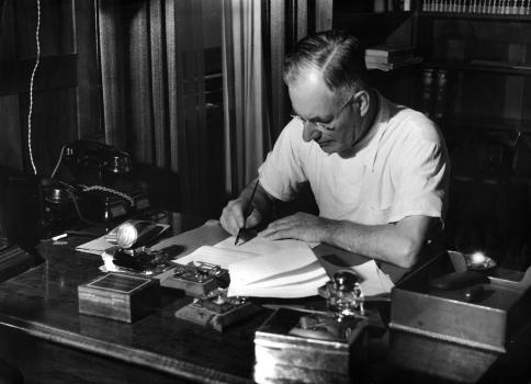 John Curtin working at his desk on a Sunday morning, Lodge study, Canberra, 1942, John Curtin Prime Ministerial Library, JCPML00376/6.